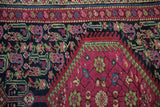 Close-up of antique Karabagh runner: plum field with henna plant boteh, navy border.