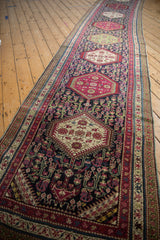 Antique Karabagh runner with plum and ivory hexagonal medallions and delicate floral vine motifs.