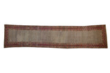 Vintage Afghani rug runner with lattice field, geometric floral borders in ivory, red, and teal.