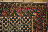 Vintage Afghani runner corner with geometric, vine, and lattice patterns in teal, red, beige.