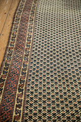 Hand knotted Afghani runner's ivory field, madder root red, dusty teal lattice, and geometric border.