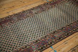 Vintage Afghani runner's red, teal, ivory geometric lattice field and patterned border.