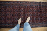 Intricate Herati design with ruby red and navy blue on a vintage Engelas runner.