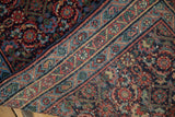 Folded corner of a vintage Engelas runner showing its intricate vine border and dense Herati pile.
