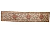 Antique Serab runner with time-softened chestnut and sand geometric medallions.