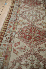 Antique Serab runner's worn pile and reciprocating pawn border motif in earthy tones.