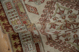Detailed distressed pile of the antique Serab runner, showcasing geometric patterns and pawn motif.