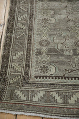 Vintage distressed Malayer runner's serrated leaf border and abrashed field of oxidized silver.