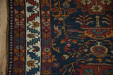 Serrated leaf vine main border detail on a navy vintage Persian rug runner.