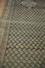 Repeating boteh pattern on the Malayer runner with distressed knot heads and soft teal abrashes.