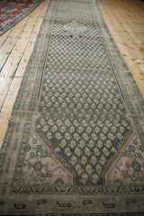 Distressed Malayer runner detail: repeating dusty teal and antique ivory botehs.