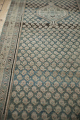 Distressed Malayer rug field, featuring alternating ivory boteh pattern on dusty teal.