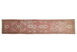 Vintage Distressed Dargezine runner in faded raspberry red, pale blue, and stylized floral patterns.
