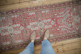 Distressed Dargezine runner with raspberry red and powder blue shadow medallion floral motifs.