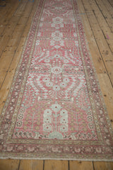 Distressed Dargezine runner detail: pale raspberry, powder blue floral motifs, and woven texture.