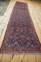 Vintage Persian Tabriz rug runner's narrow inner border and Herati pattern in navy and red.
