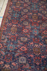 Hand-knotted vintage Tabriz Herati pattern featuring royal blue and cherry red hues.