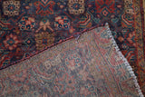 Hand-knotted vintage Tabriz runner's Herati design pile and colorful woven foundation.