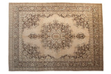 Vintage distressed Tabriz carpet with a scalloped roundel medallion in chocolate brown and sand on a beige field.