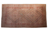 Distressed Khotan carpet with double medallions, floral pinwheels, brick red, muted gray, 9x17.3.