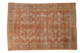 Hand-knotted distressed Mahal carpet: terracotta field, faded floral and scrolling patterns.