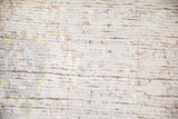 Distressed Afghani Oushak carpet, showing wear to ivory knot heads and visible foundation.