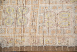 Distressed Afghani Oushak rug's worn pile texture, exposed foundation, and intact side selvage.
