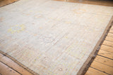 Distressed platinum and ivory pile with foundation wear, showcasing the intact side cord selvage.