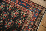 Hand-knotted pile of a Persian runner with rose bouquets and intricate blue and blush borders.