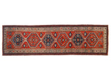 Vintage Serab rug runner with interconnected hexagonal medallions in brick red and sapphire blue.
