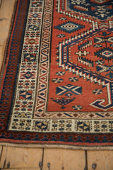 Detailed corner of a Persian Serab runner with serrated medallions and multi-layered geometric borders.