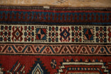 Intricate geometric border with crab-style forms and restored selvage on a Persian Serab runner.