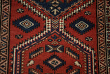 Detail of hand-knotted crab forms and serrated medallions on a vintage Persian Serab runner.
