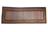 Vintage Northwest Persian runner with staggered shrub motifs on a platinum field and a gold serrated leaf border.