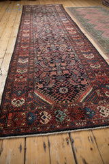Angled perspective of the vintage Persian Hamadan runner showing its full length and pattern.