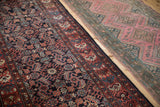Hand-knotted texture and geometric floral guls on a vintage Persian Hamadan runner.