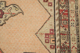 A close-up showing the even wear to the knot heads on a distressed antique Karabagh rug.