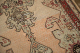 Detailed view of the distressed low pile and abrash on an antique Karabagh rug.