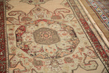 Evenly worn pile showing the geometric center medallion of an antique Karabagh runner.