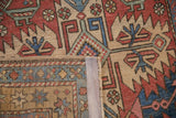 A view of the hand-knotted back and restored side cord of a vintage Persian Heriz rug.
