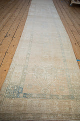 Faded ivory and dusty blue geometric patterns on a distressed Karaja runner.