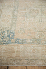 Distressed Karaja runner detail with faded ivory, beige, and pale blue hook and latch motifs.