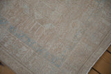 Distressed vintage Karaja runner pile texture, with muted beige and subtle powder blue designs.