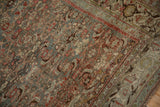 Worn pile showing knot heads across the Herati design in slate blue and ruby red.