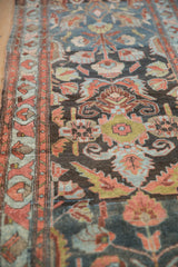 Mehreban runner's worn surface with faded coral arabesque border and floral motifs.