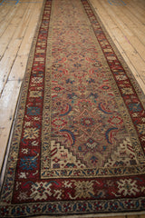 Full length perspective of an antique Karabagh runner highlights the repeating Herati field design.