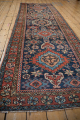 Close-up of Karaja runner's navy field with geometric medallions and floral border.