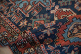 Hand-knotted pile of a Vintage Karaja runner, featuring navy, brick red, and green geometric motifs.