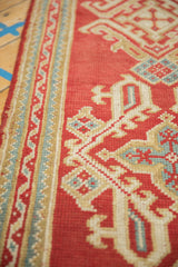 Vintage Oushak runner, ribboned vine border, quatrefoil hook and latch motifs.