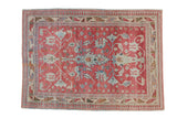 Vintage distressed Anatolian rug with geometric blossomed palmettes in powder blue and ivory on a dusty raspberry red field.